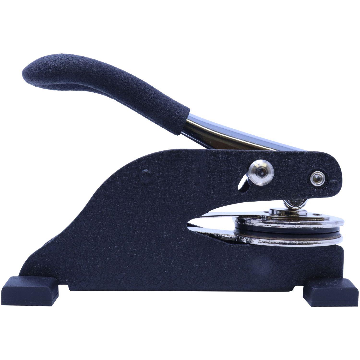 Real Estate Appraiser Desk Seal Embosser with a black handle and metal components, designed for creating embossed imprints on documents.