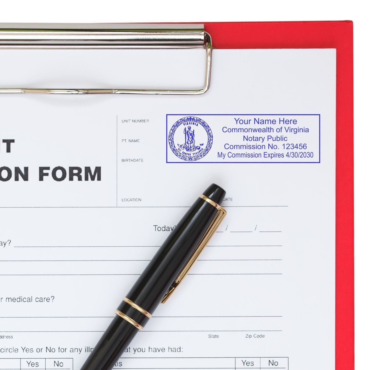 A Super Slim Pre-Inked State Seal Notary Stamp imprint on a document, next to a pen and clipboard, showing a Virginia notary seal.