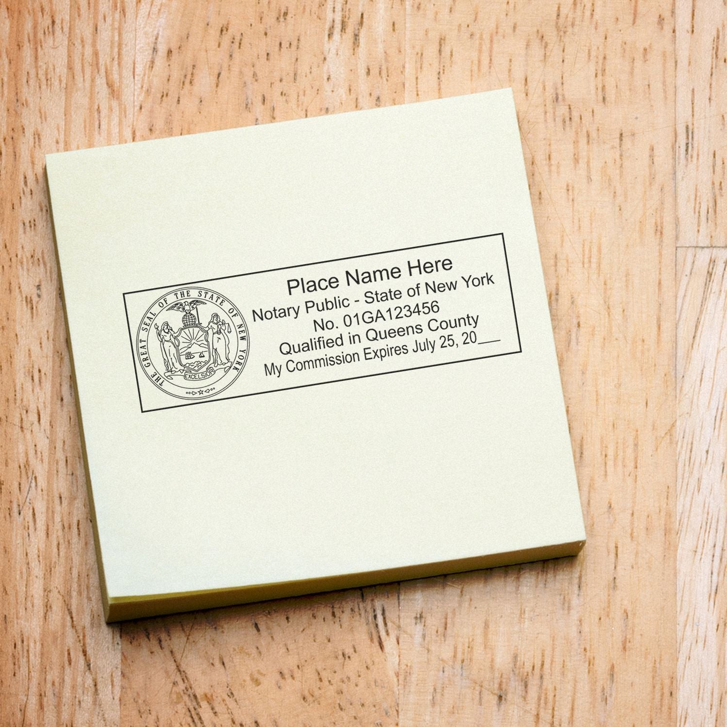 MaxLight Pre-Inked State Seal Notary Stamp in use on a yellow notepad, displaying a notary public seal and commission details.