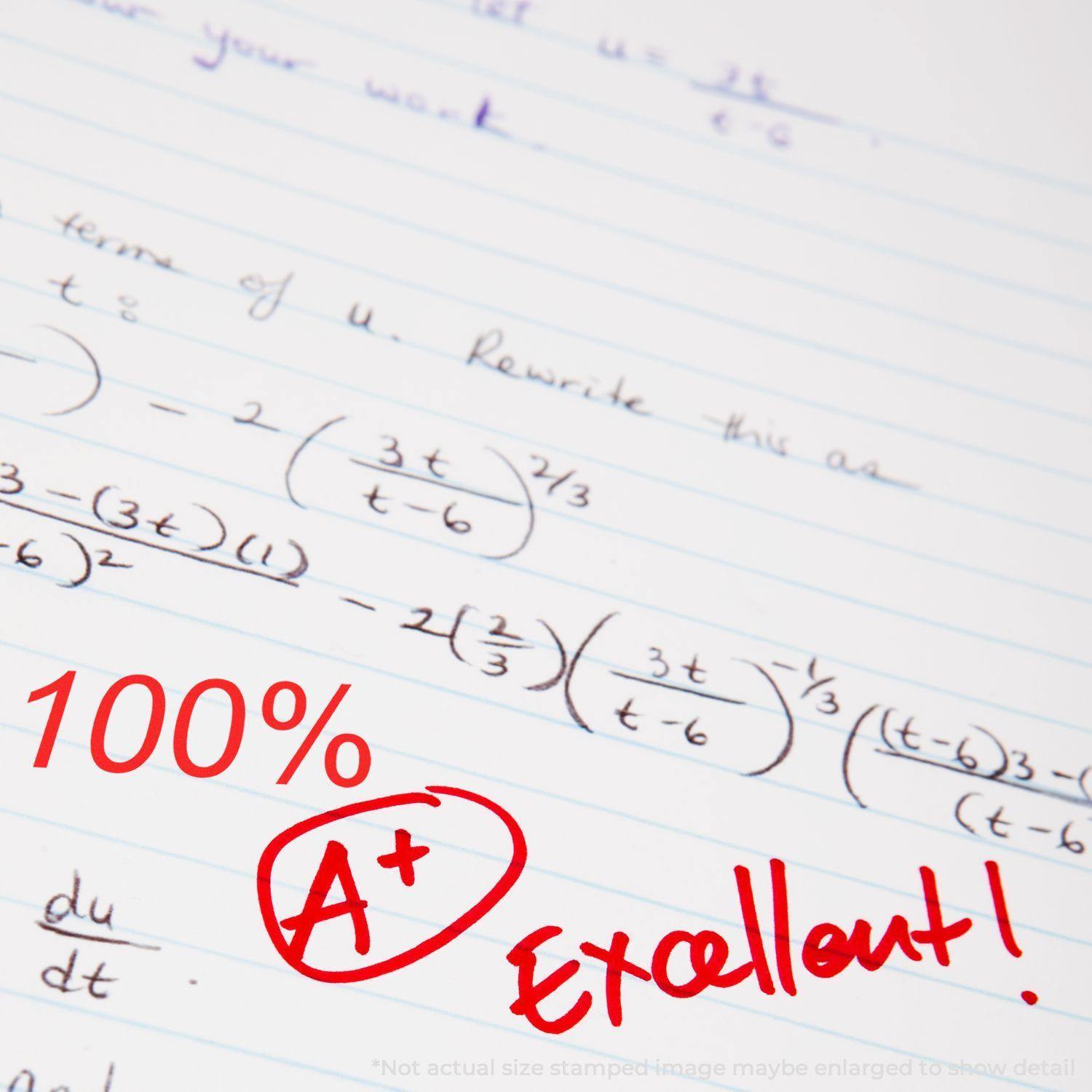 A paper with math equations stamped with 100% A+ Excellent! in red ink using the Large 100 Percent Rubber Stamp.