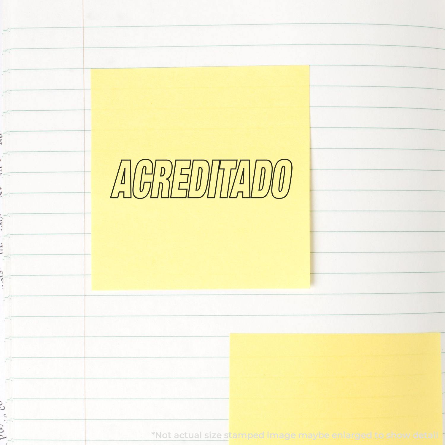 Yellow sticky note with "ACREDITADO" stamped in black ink using the Acreditado Rubber Stamp, placed on a lined notebook page.