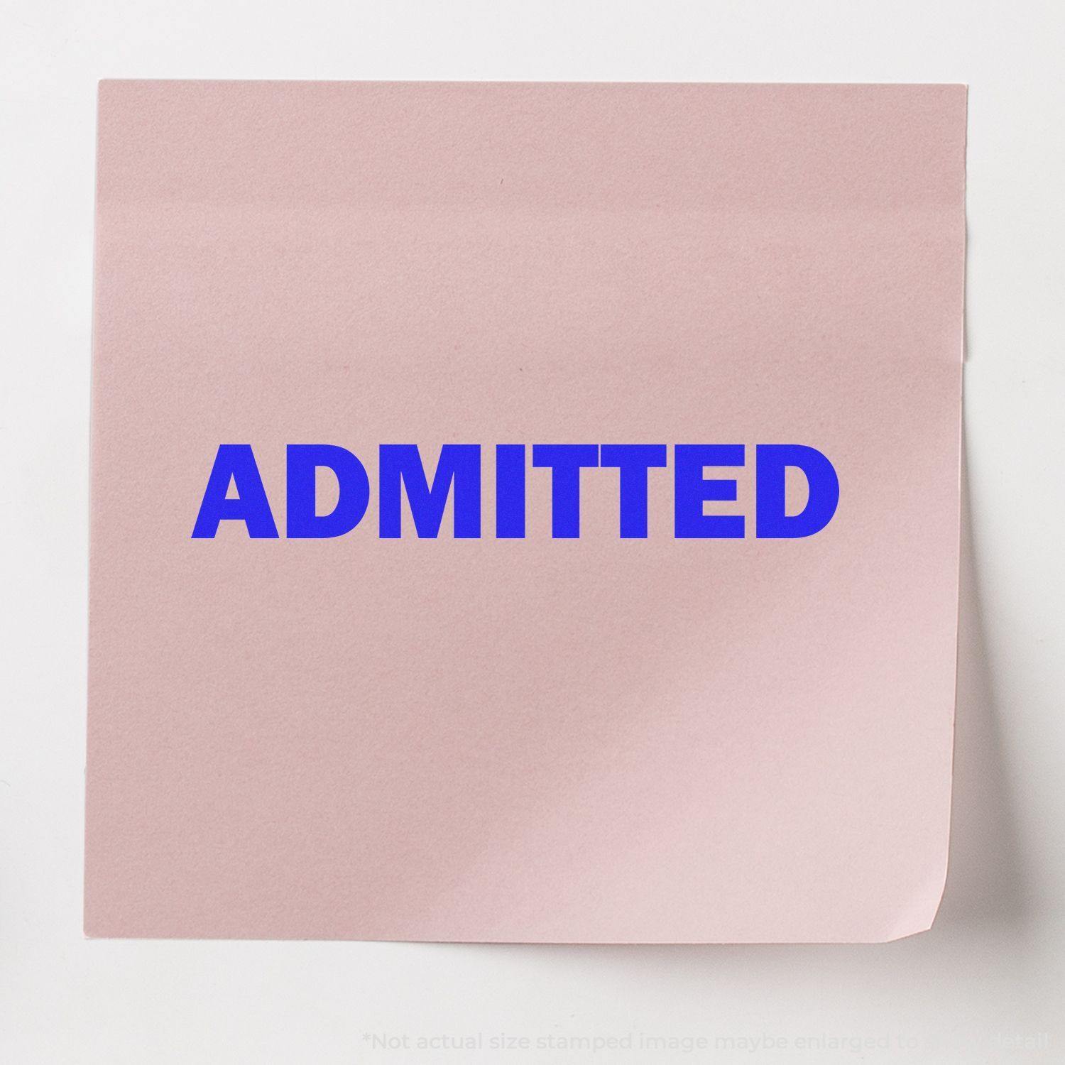 Pink paper with the word ADMITTED stamped in bold blue ink using the Large Pre-Inked Admitted Stamp.