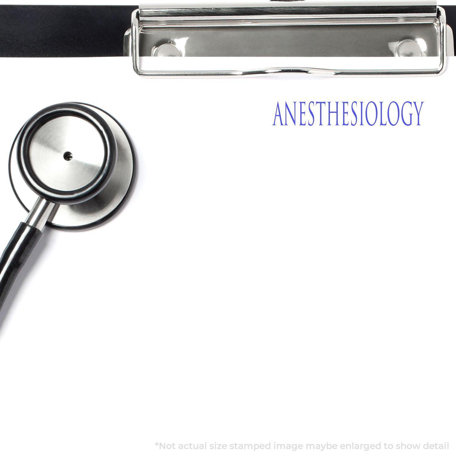 Anesthesiology Rubber Stamp in use on a clipboard with a stethoscope beside it. The word "ANESTHESIOLOGY" is stamped in blue ink.