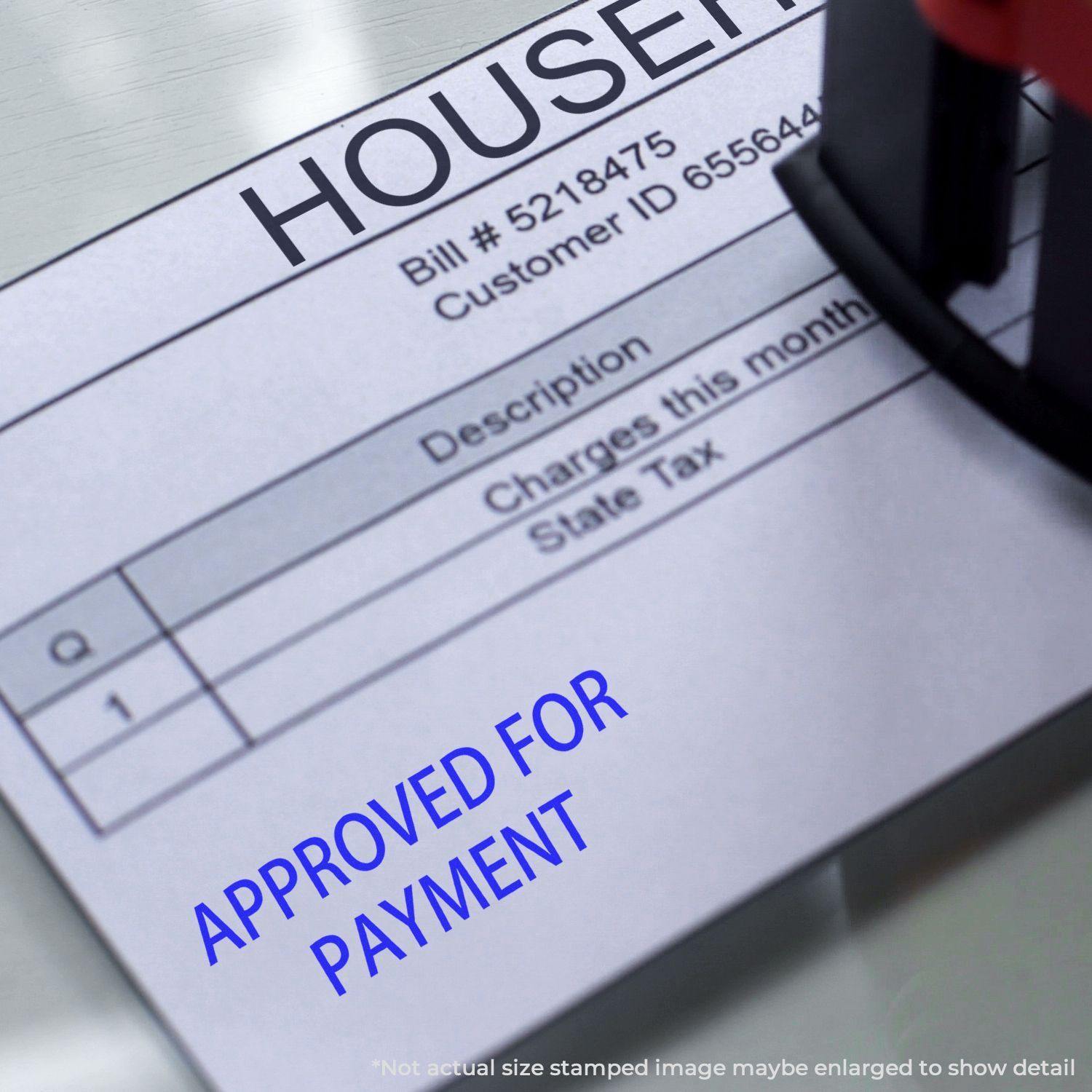 A Large Self Inking Approved For Payment Stamp marking a document with APPROVED FOR PAYMENT in blue ink on a bill with itemized charges.