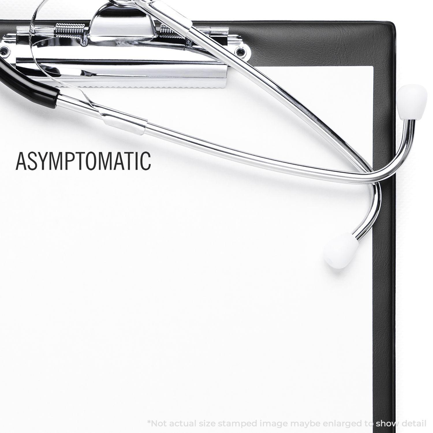 Slim Pre-Inked Asymptomatic Stamp used on a clipboard with a stethoscope, showing the word ASYMPTOMATIC stamped in black.