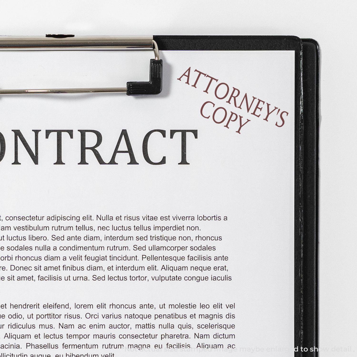 A clipboard with a contract stamped ATTORNEY'S COPY using a Large Attorneys Copy Rubber Stamp in red ink.