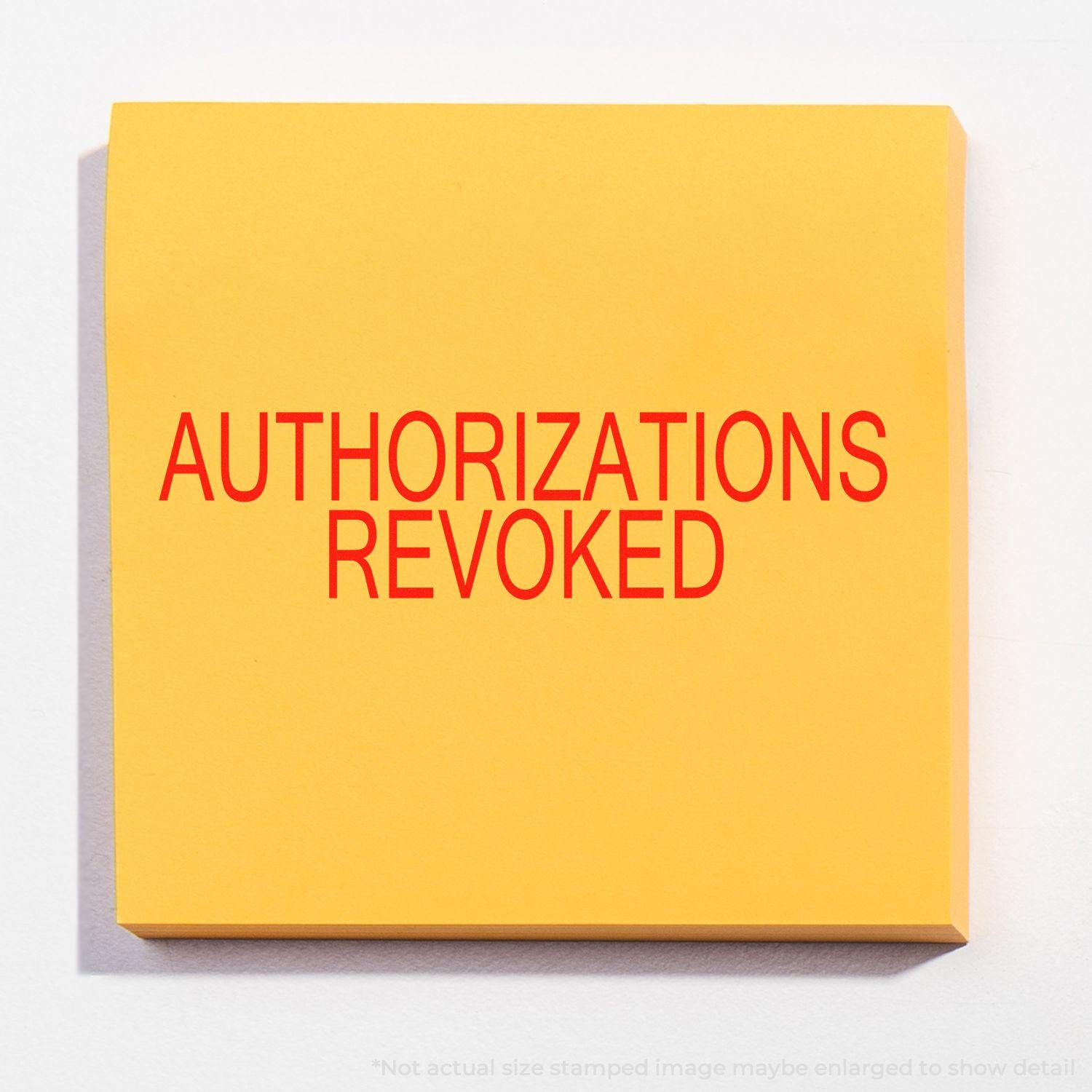 Yellow paper with AUTHORIZATIONS REVOKED stamped in red using an Authorizations Revoked Rubber Stamp.