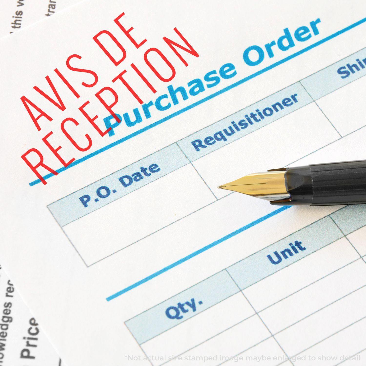 Slim Pre-Inked Avis De Reception Stamp used on a purchase order form with a pen placed on the form.