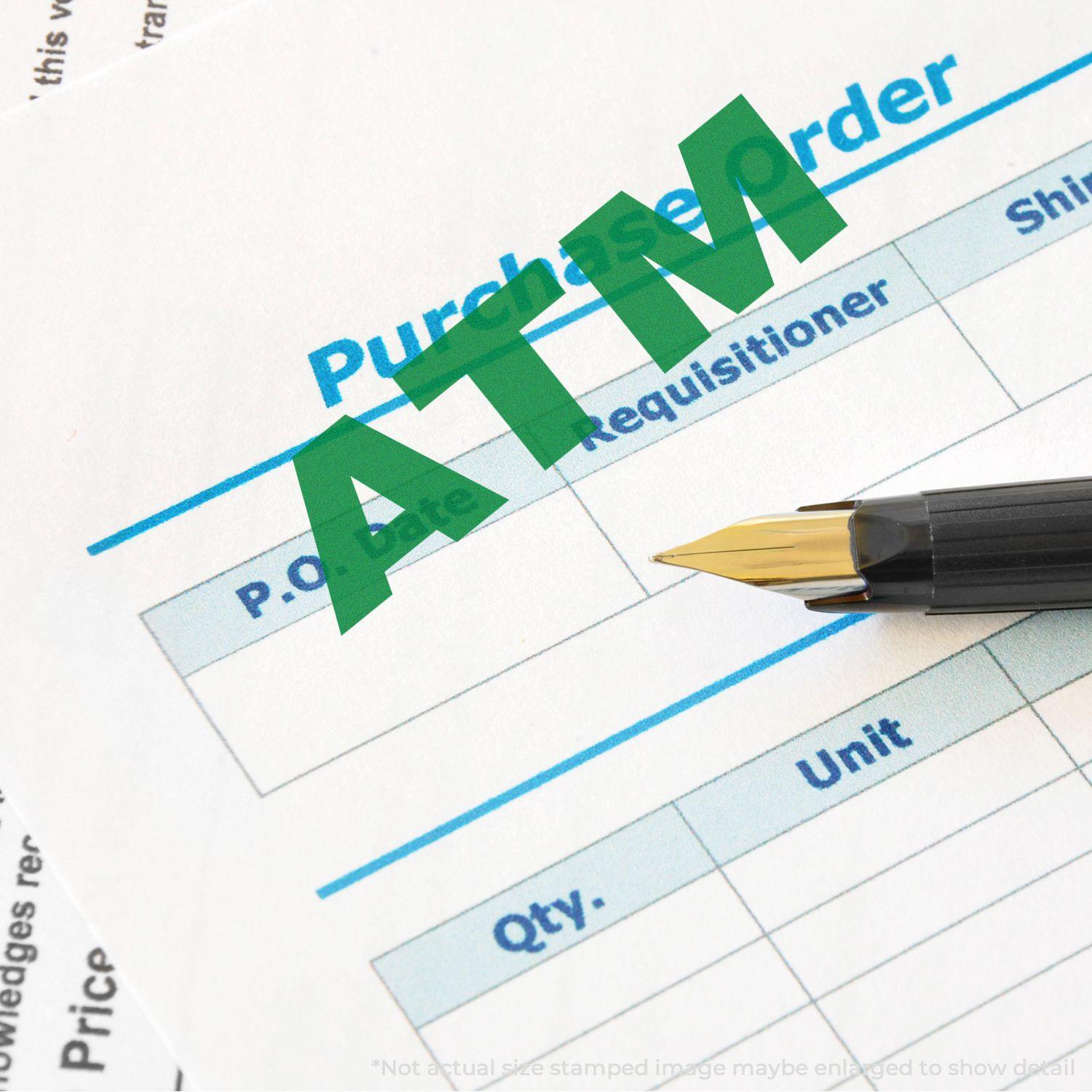 A purchase order form stamped with a green ATM using a bank stamp ATM rubber stamp, with a pen placed beside it.