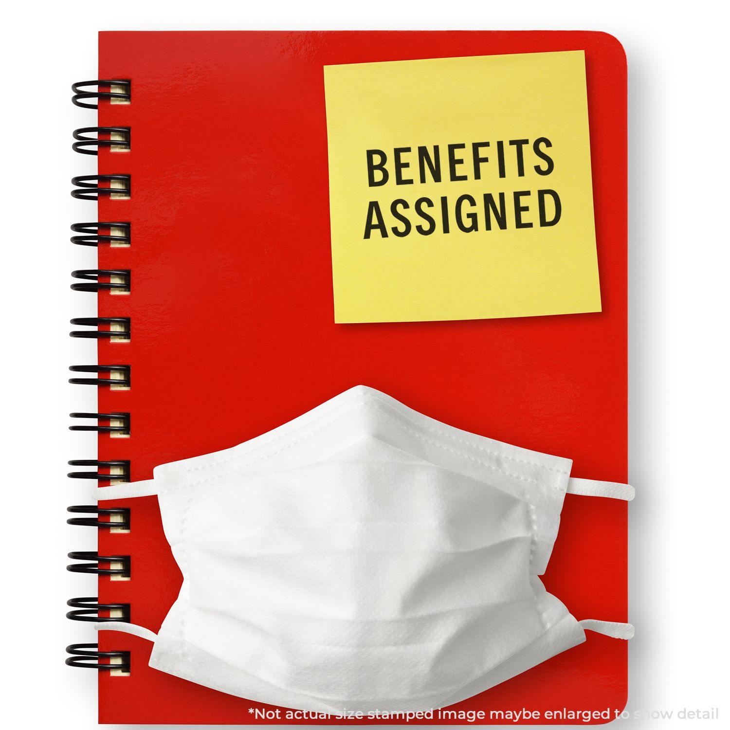 Red notebook with a sticky note reading BENEFITS ASSIGNED and a white mask. Large Pre-Inked Benefits Assigned Stamp used on the note.