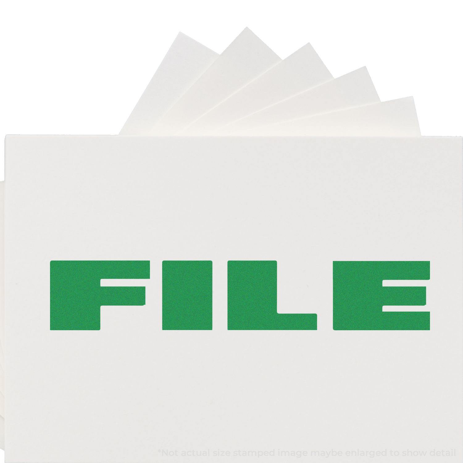 A stock office rubber stamp with a stamped image showing how the text "FILE" in bold font is displayed after stamping.