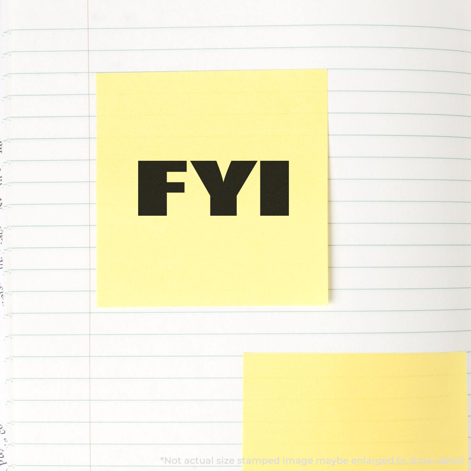 Slim Pre-Inked Bold FYI Stamp used on a yellow sticky note placed on a lined notebook page.