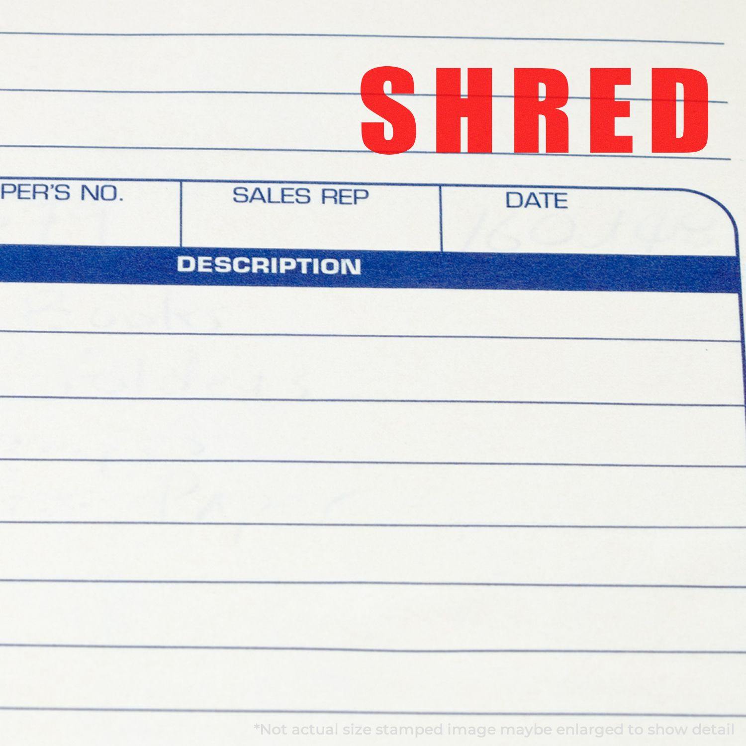 Large Pre-Inked Bold Shred Stamp marking SHRED in red ink on a document with blue lines and text fields.