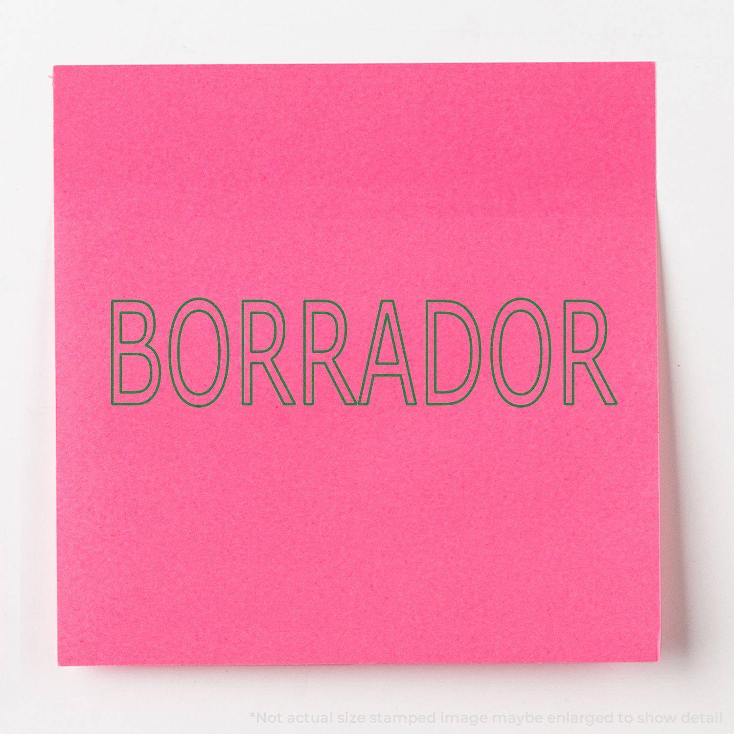 Large Self Inking Borrador Stamp imprint on a bright pink sticky note, showcasing the clear and bold BORRADOR text.