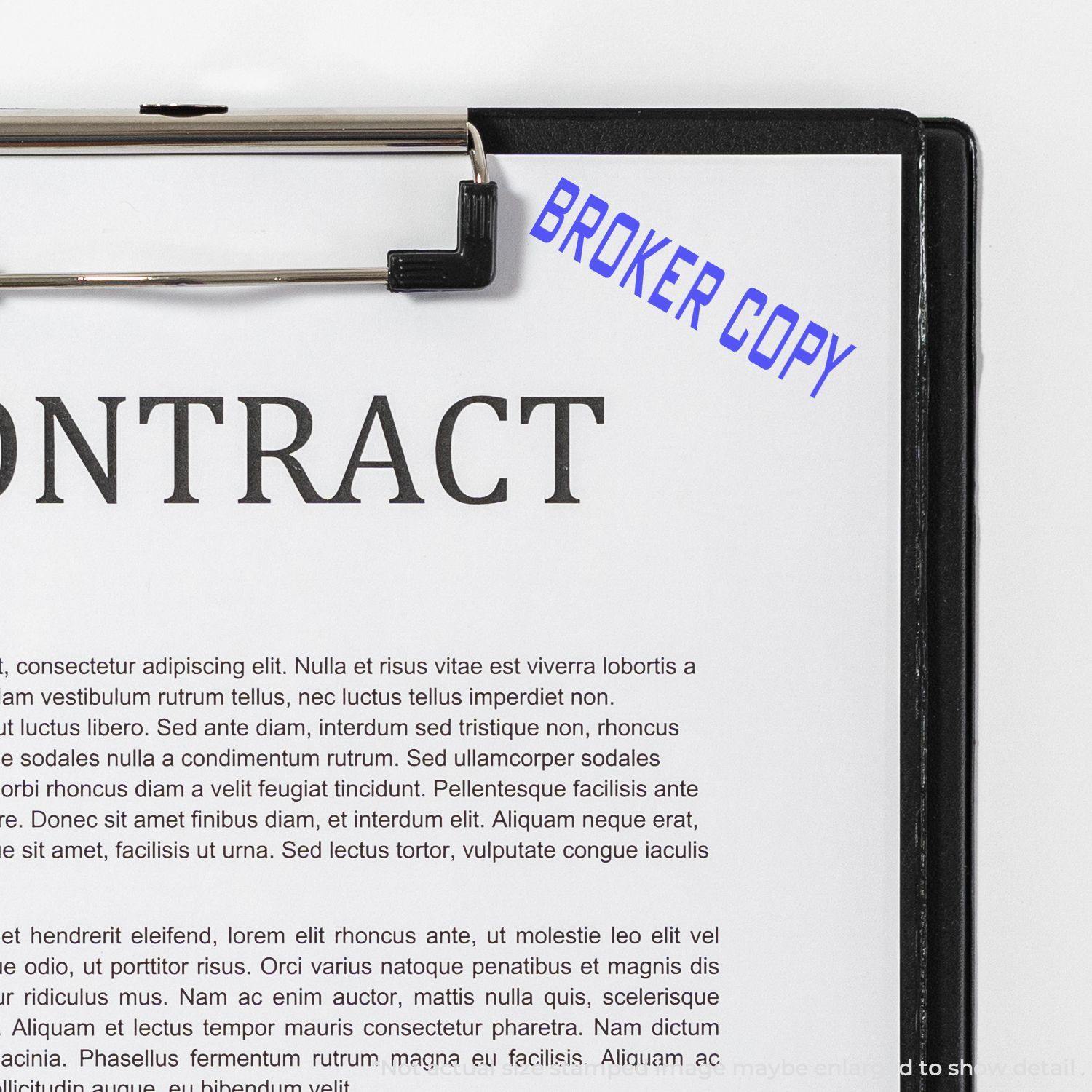 Contract with a blue 'Broker Copy' rubber stamp on the top right corner, clipped to a black clipboard.