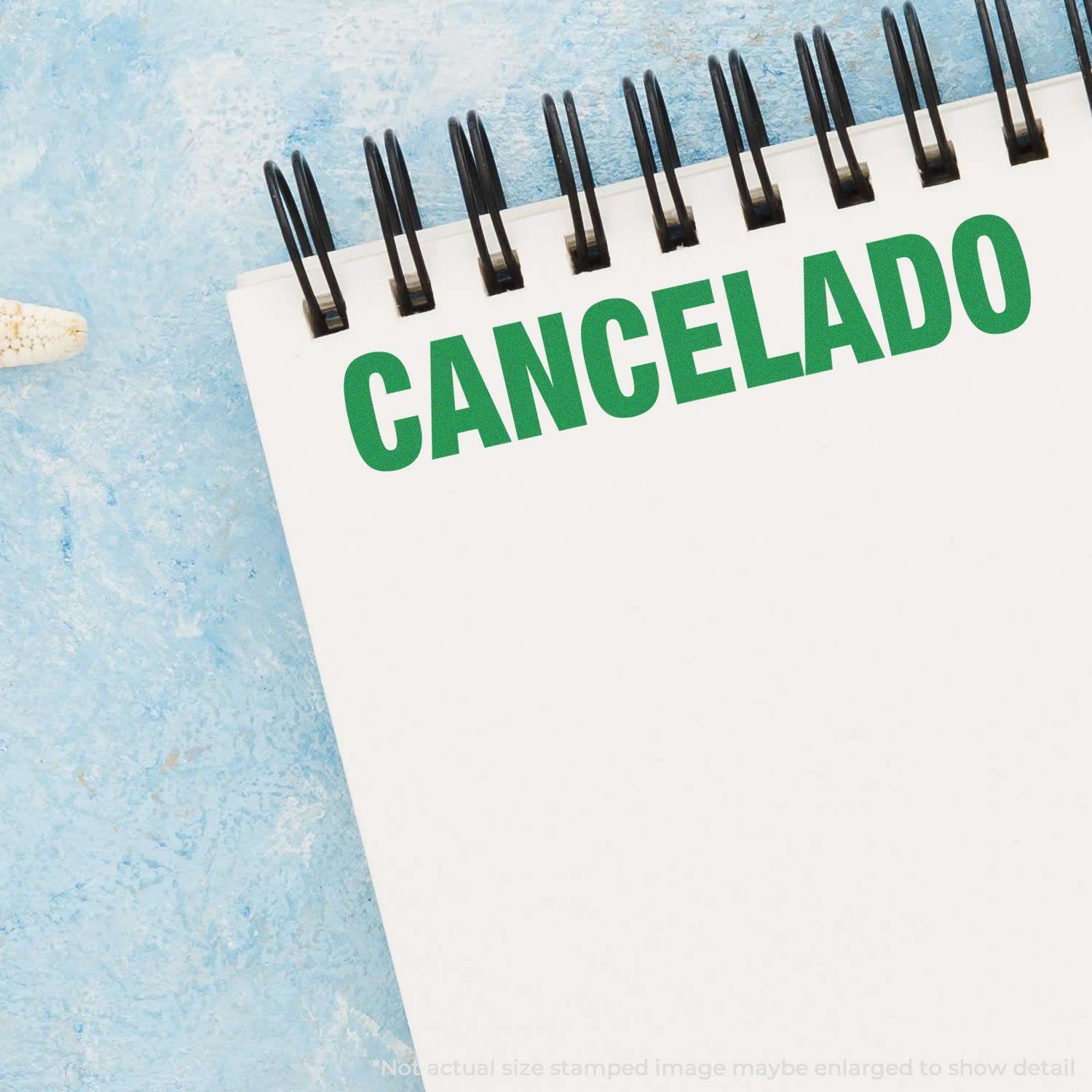 A self-inking stamp with a stamped image showing how the text "CANCELADO" in a large font is displayed by it after stamping.