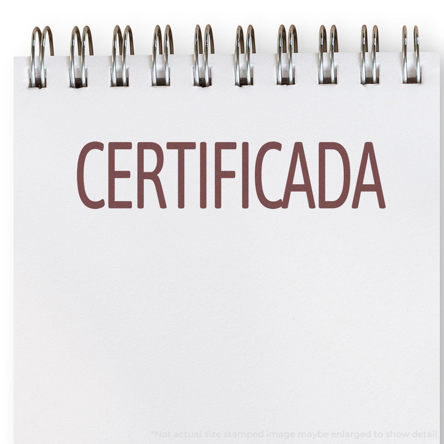 A Certificada Rubber Stamp imprint on a white notepad with spiral binding, showing the word CERTIFICADA in bold, brown letters.