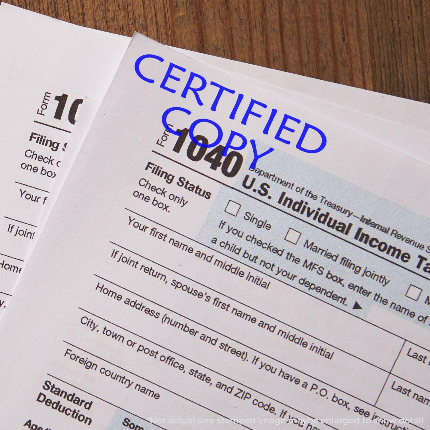 Slim Pre-Inked Certified Copy Stamp marking CERTIFIED COPY in blue ink on U.S. Individual Income Tax Return forms.