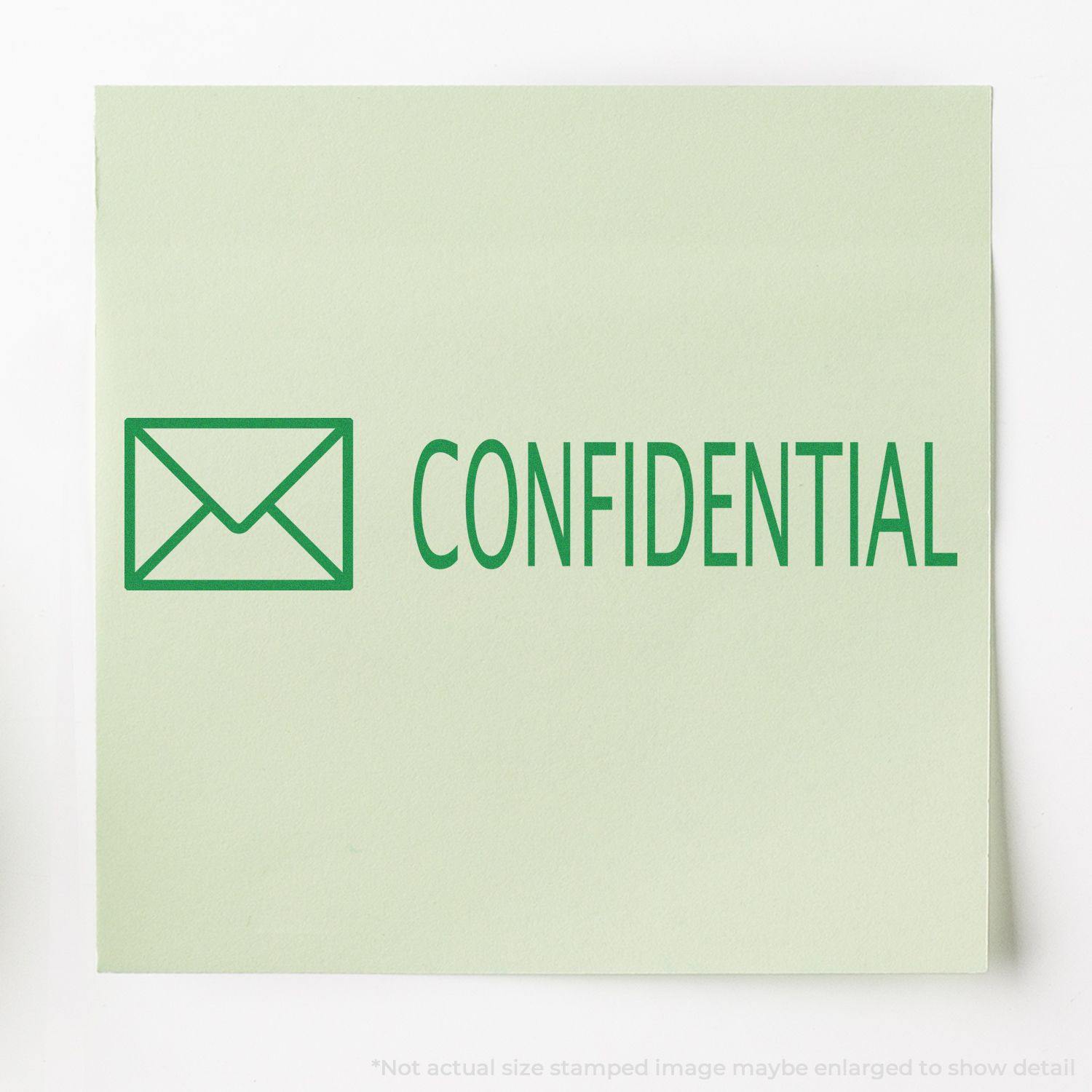 Green paper stamped with Confidential with Envelope Rubber Stamp in green ink, featuring an envelope icon next to the word Confidential .