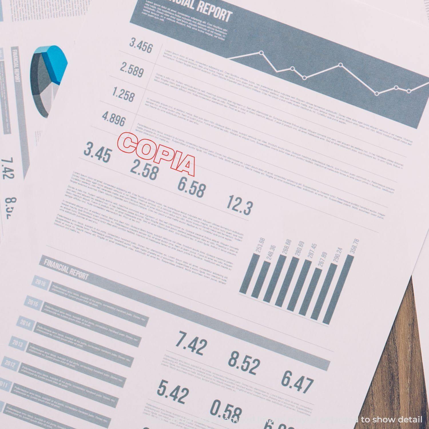 Financial reports stamped with Copia Rubber Stamp in red ink, showing various charts, graphs, and data tables on a wooden surface.