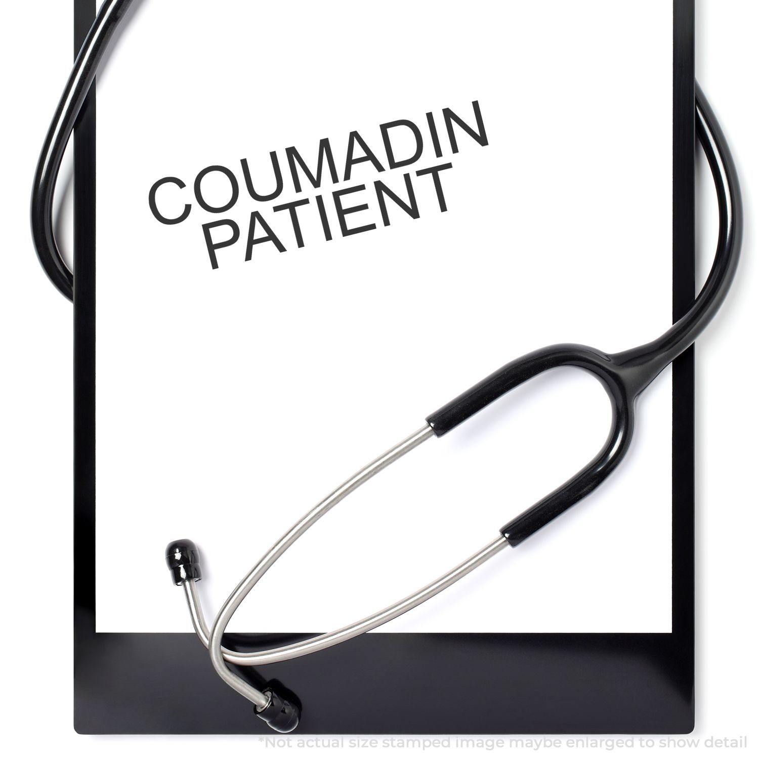 A clipboard with a stethoscope and a paper stamped with Coumadin Patient using the Coumadin Patient Rubber Stamp.