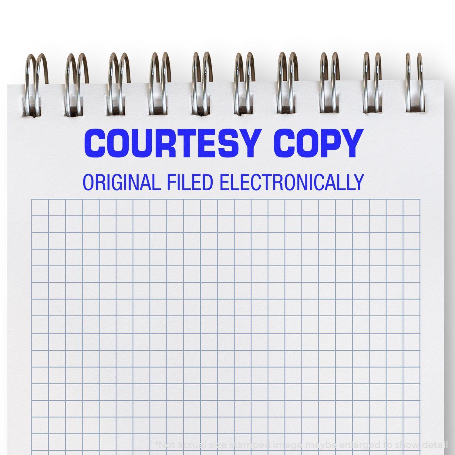 A notepad stamped with Courtesy Copy Original Filed Electronically Rubber Stamp in blue ink, featuring a grid pattern on the paper.