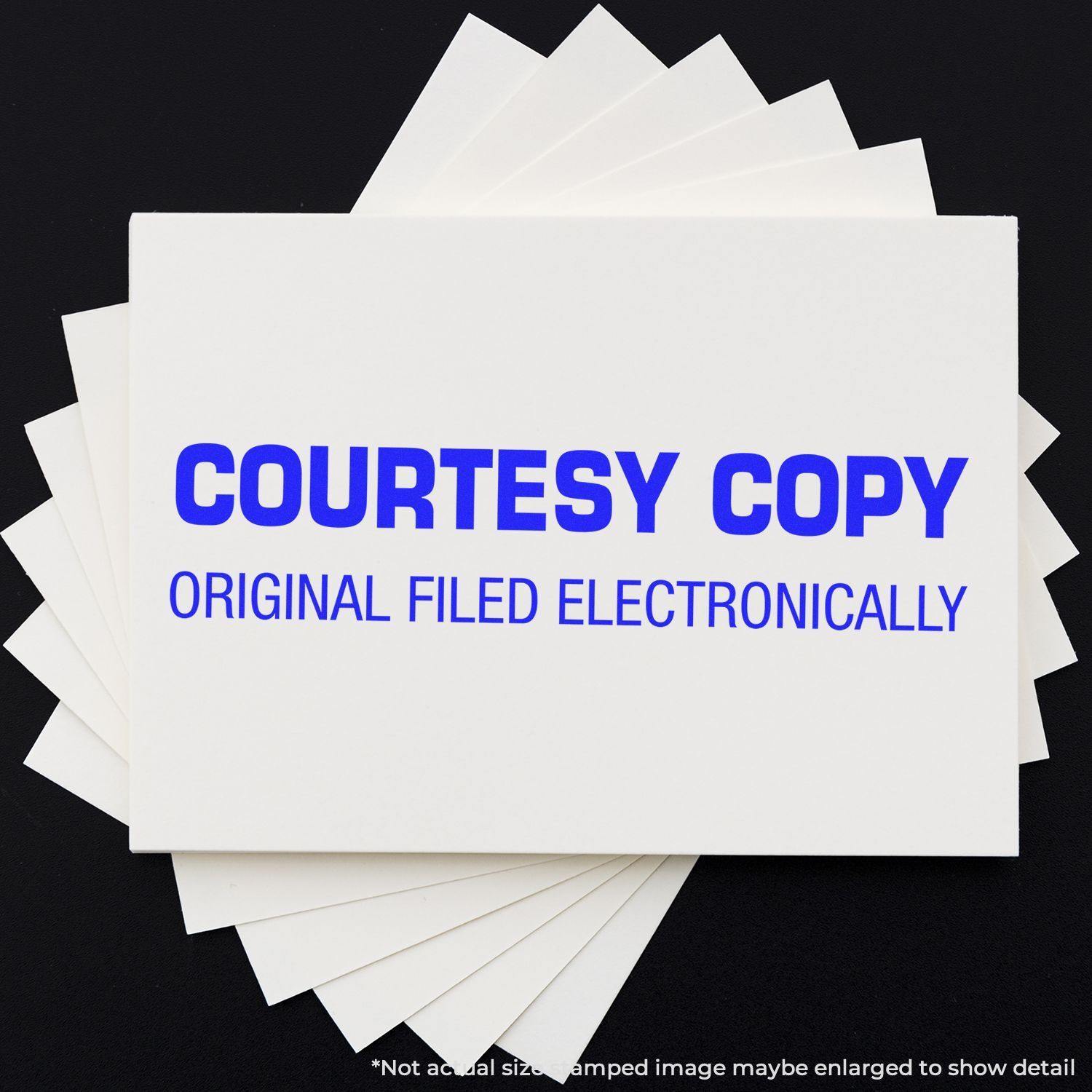 Large Self Inking Courtesy Copy Original Filed Electronically Stamp in blue ink on a white card, with multiple cards underneath.