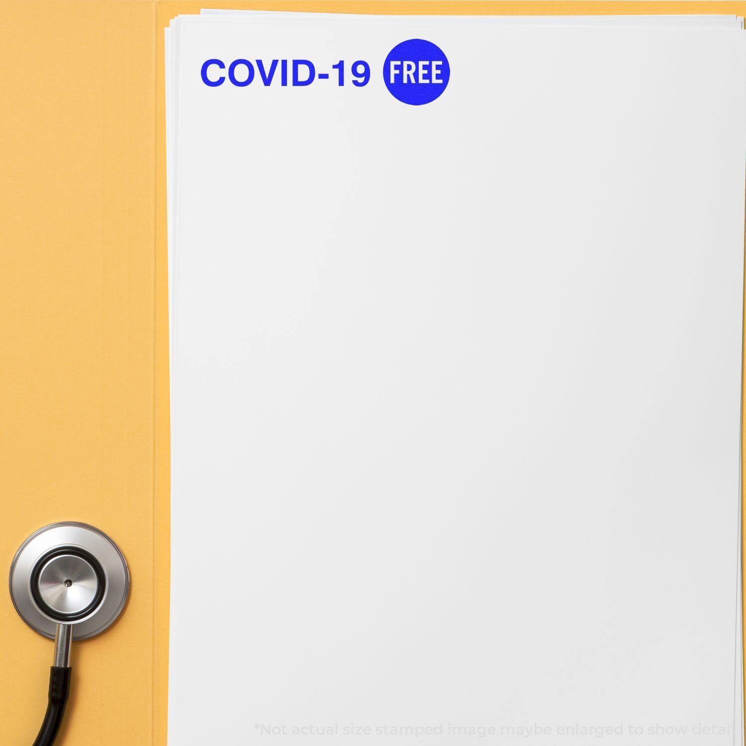 Large Pre-Inked Covid-19 Stamp marking COVID-19 FREE on a white sheet of paper, with a stethoscope placed beside it.