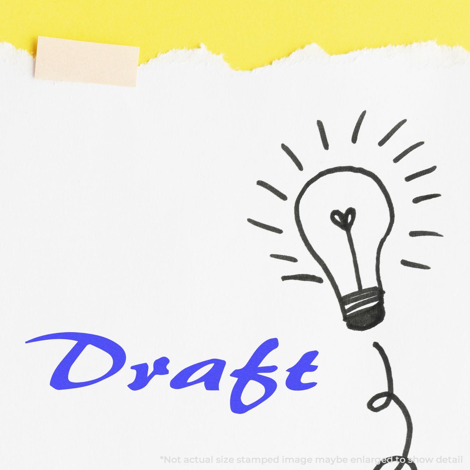 Large Self Inking Cursive Draft Stamp on white paper with a lightbulb sketch, showcasing the word Draft in blue cursive font.