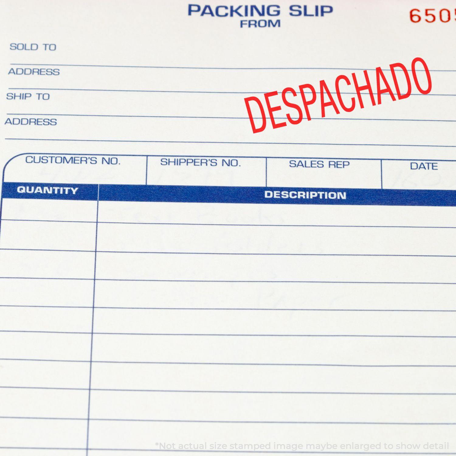 A self-inking stamp with a stamped image showing how the text "DESPACHADO" in a large font is displayed by it after stamping.