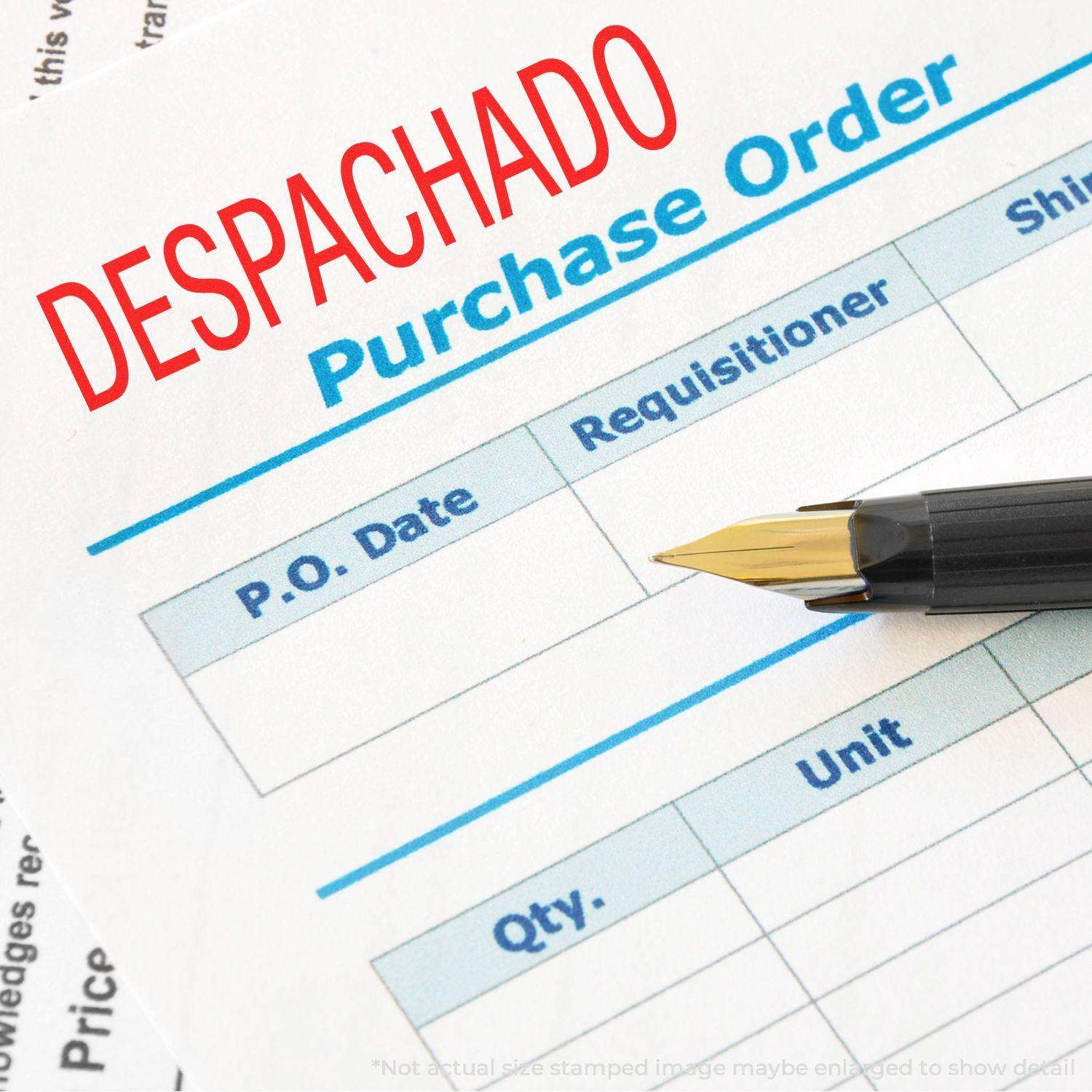 Large Despachado Rubber Stamp in red ink on a purchase order form, with a fountain pen resting on the form.