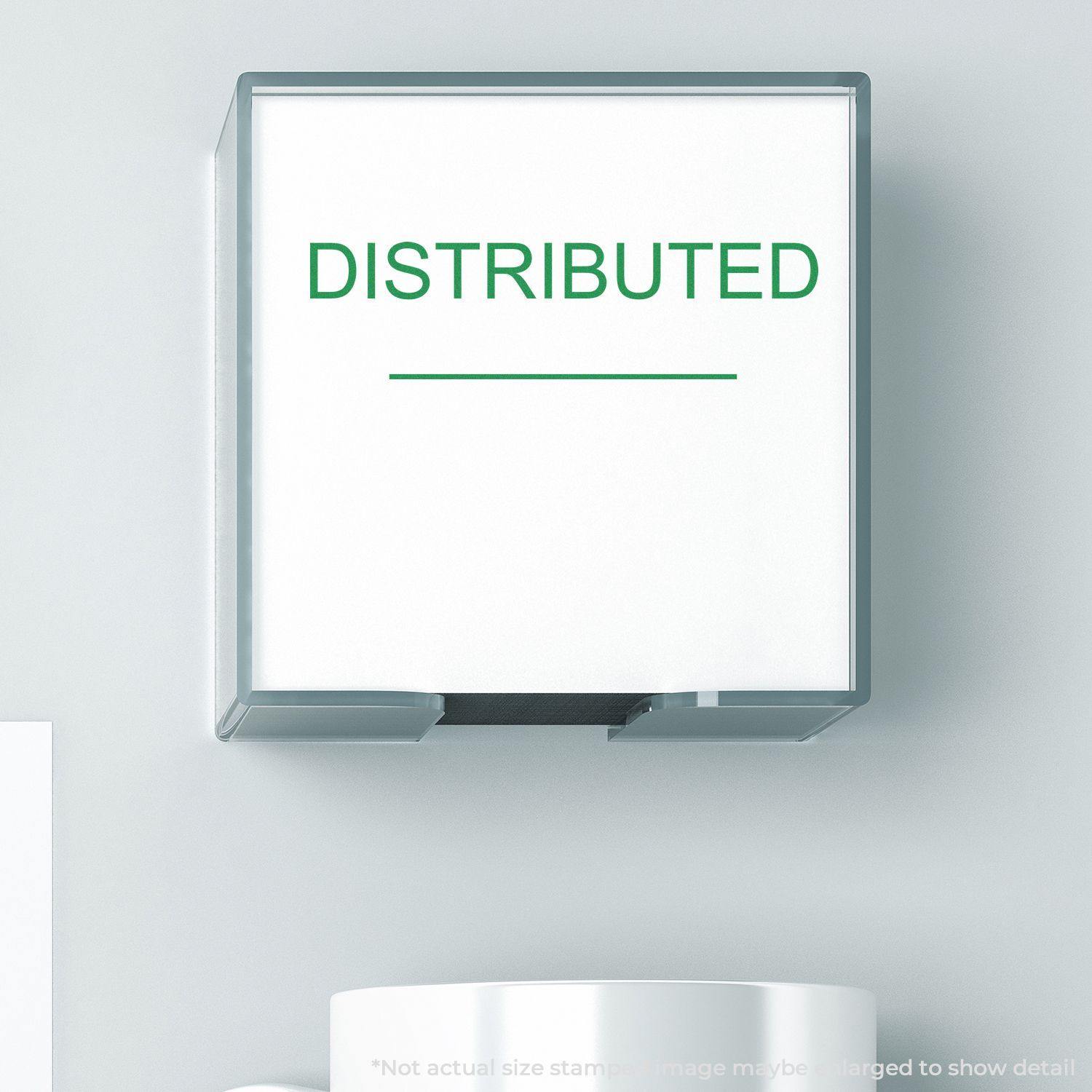 Slim Pre-Inked Distributed Stamp With Line in green ink, mounted on a wall, with a white background and a cup below.