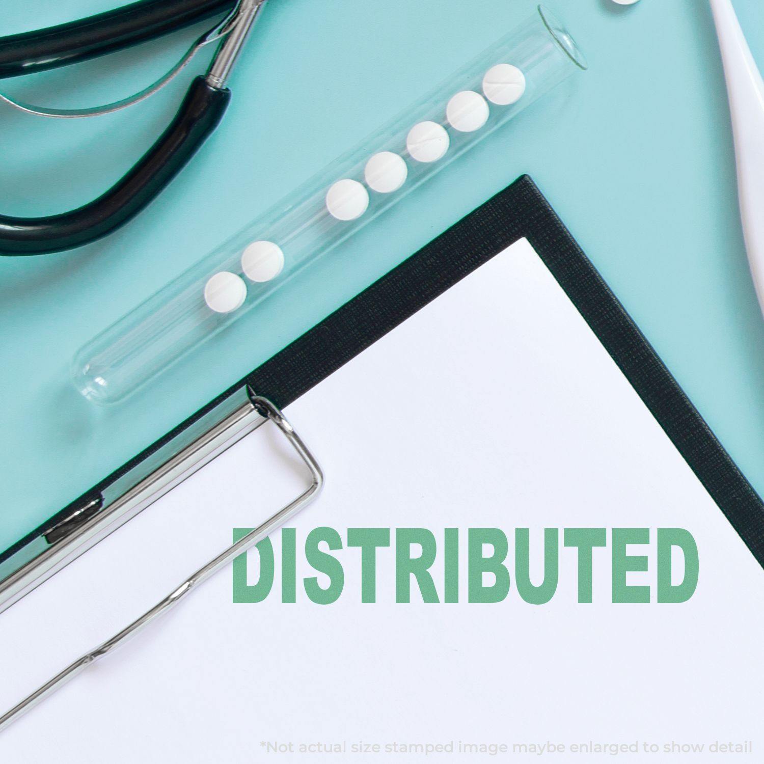 Large Distributed Rubber Stamp used on a document, surrounded by a stethoscope, clipboard, and a test tube with pills on a teal background.