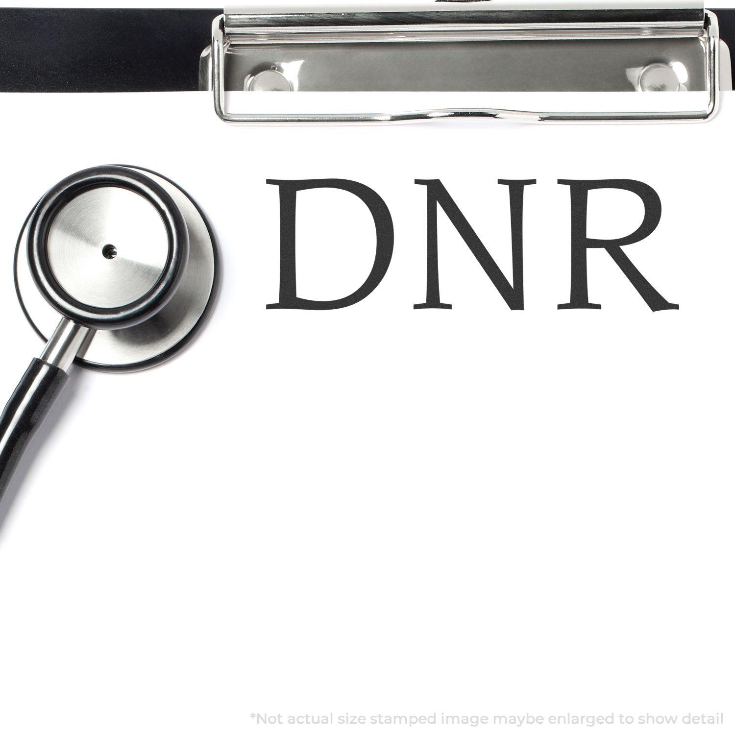 Slim Pre-Inked DNR Stamp on a clipboard with a stethoscope, indicating Do Not Resuscitate medical instruction.