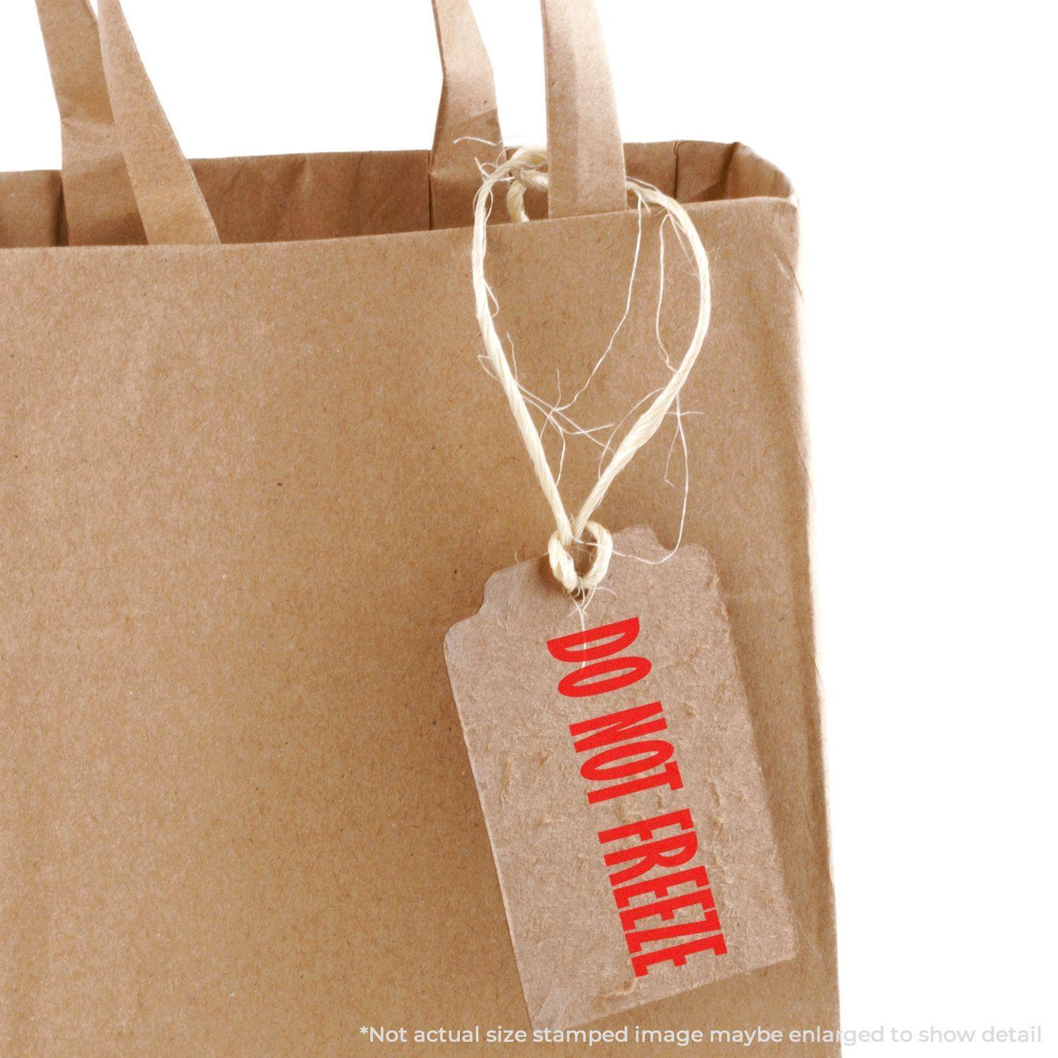 A brown paper bag with a tag stamped DO NOT FREEZE using a Slim Pre-Inked Do Not Freeze Stamp.