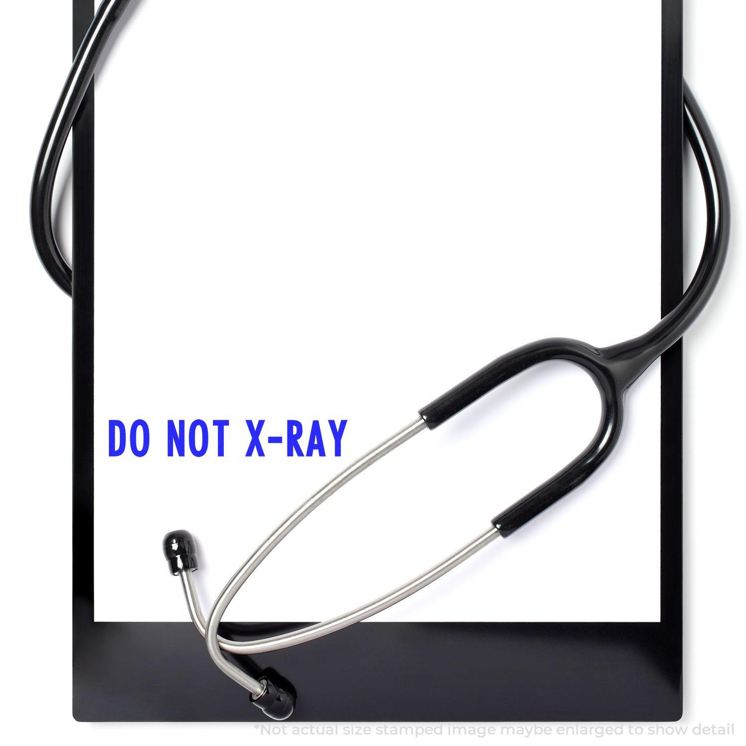 Slim Pre-Inked Do Not X-Ray Stamp used on a white paper with a stethoscope placed around it.