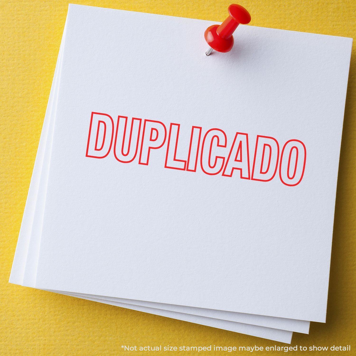 Large Pre-Inked Duplicado Stamp in red ink on white paper, pinned with a red pushpin on a yellow background.