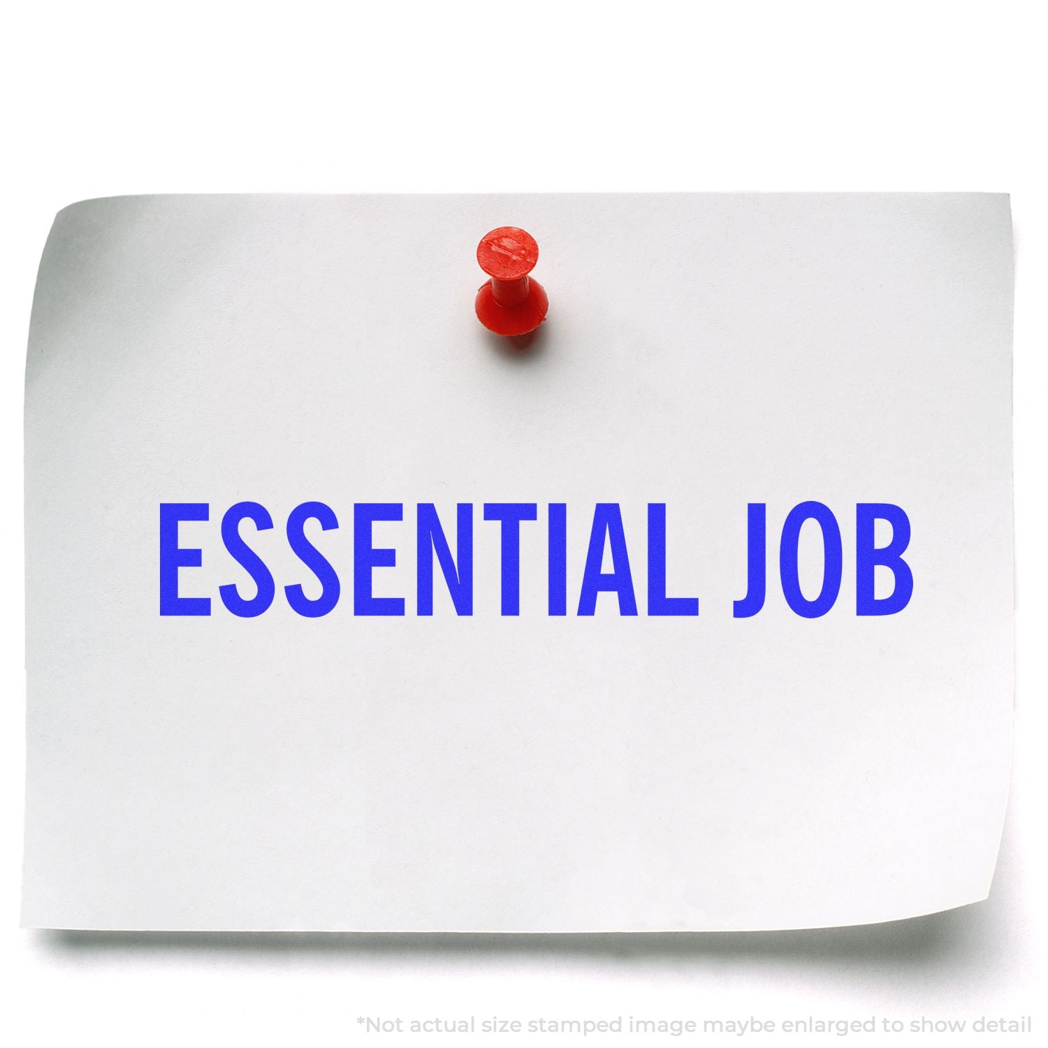 A piece of paper pinned to a board with the words ESSENTIAL JOB stamped in blue using a Slim Pre-Inked Essential Job Stamp.