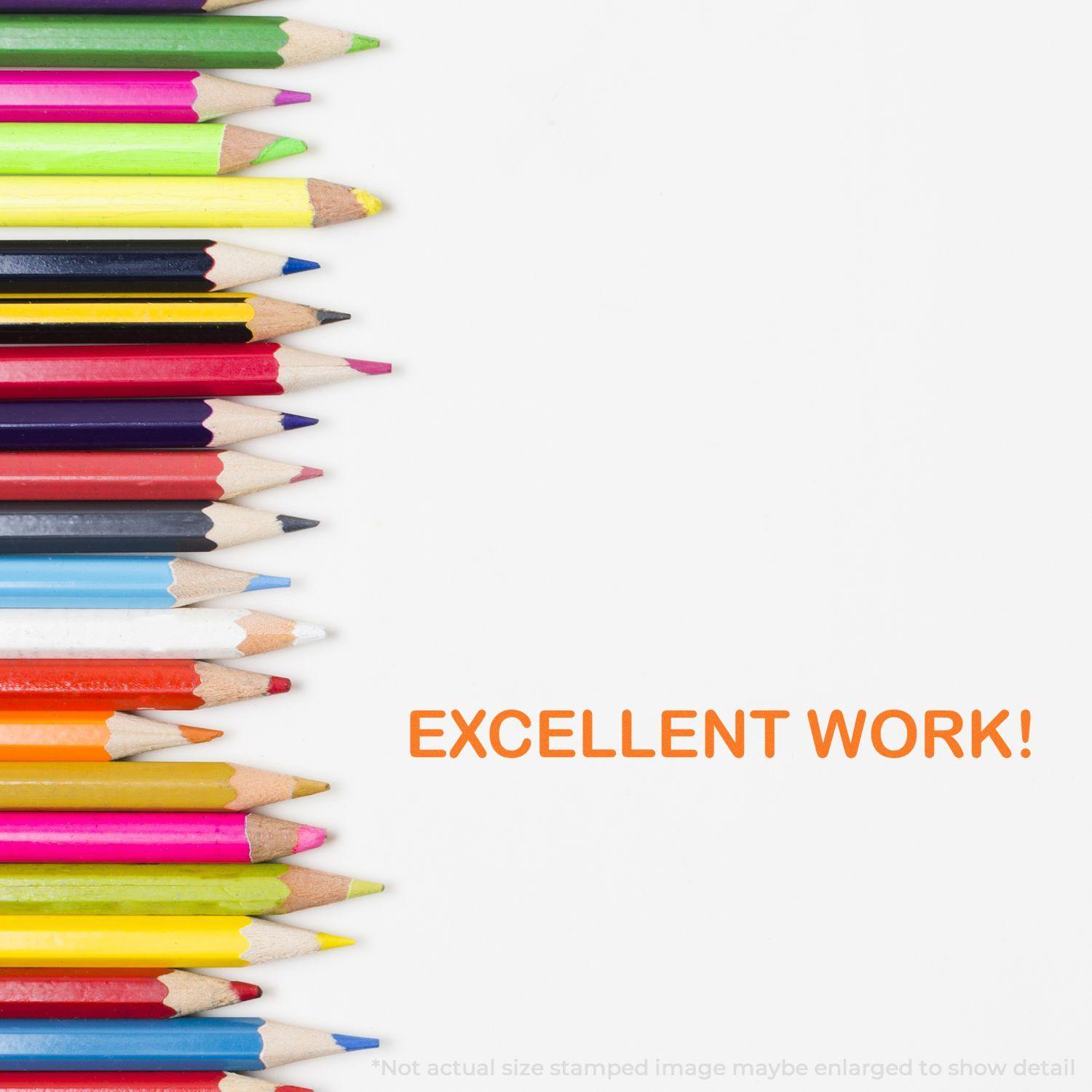 Colorful pencils aligned on the left with EXCELLENT WORK! stamped in orange on the right using the Large Excellent Work Rubber Stamp.