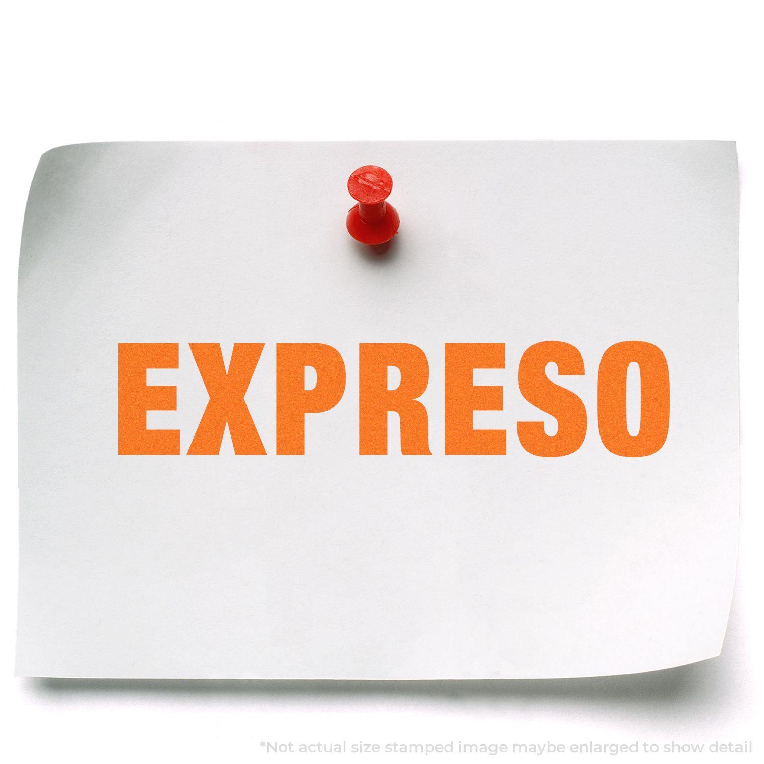 A white paper with the word EXPRESO stamped in bold orange, pinned to a board. Focus: Slim Pre-Inked Expreso Stamp.