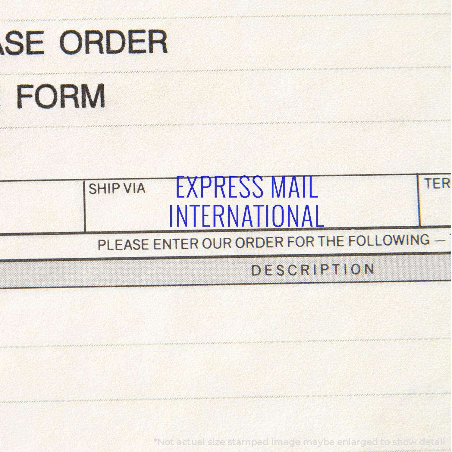 A self-inking stamp with a stamped image showing how the text "EXPRESS MAIL INTERNATIONAL" is displayed after stamping.