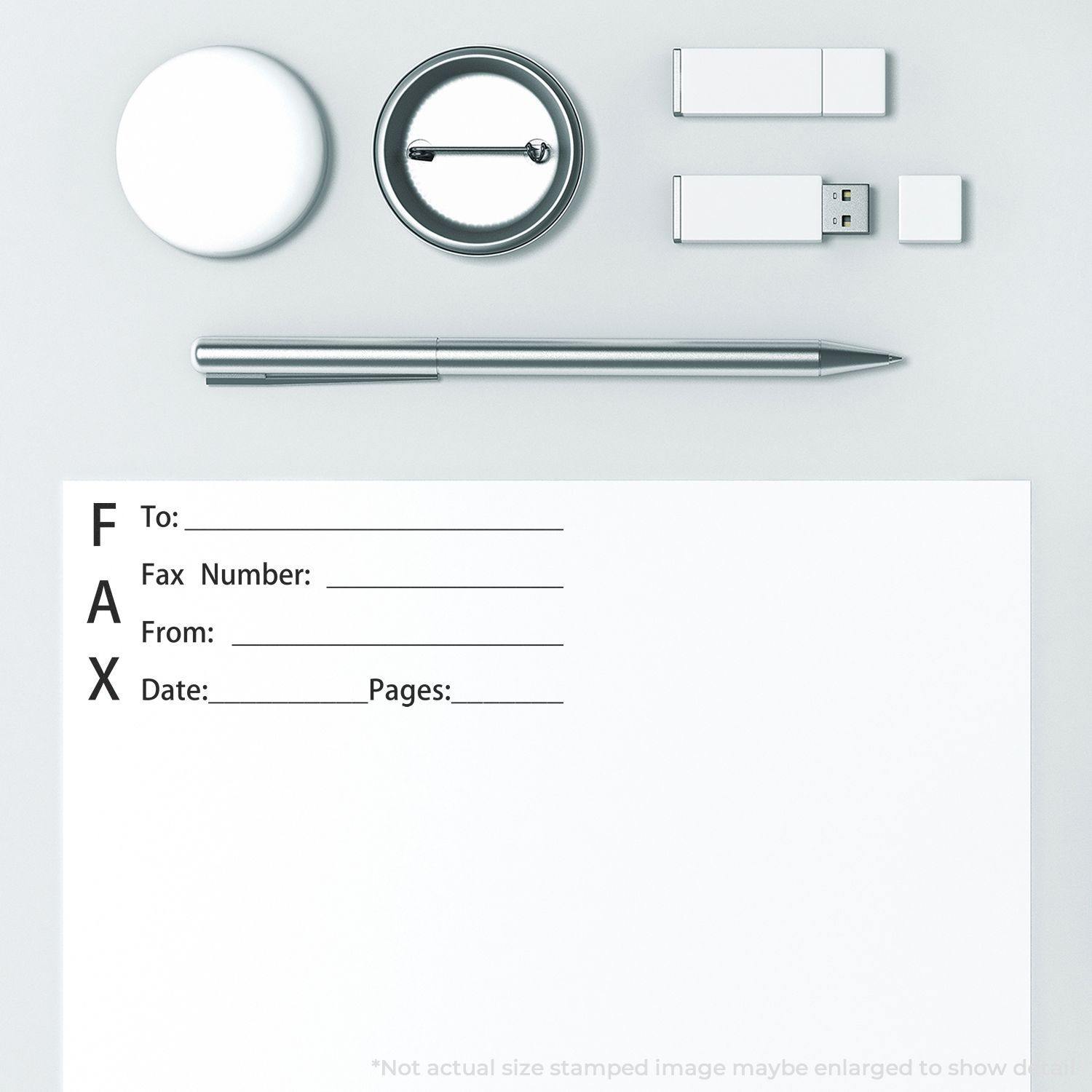 Slim Pre-Inked Fax It 1 Stamp on a white paper with fax details, surrounded by a pen, USB drives, and round objects.