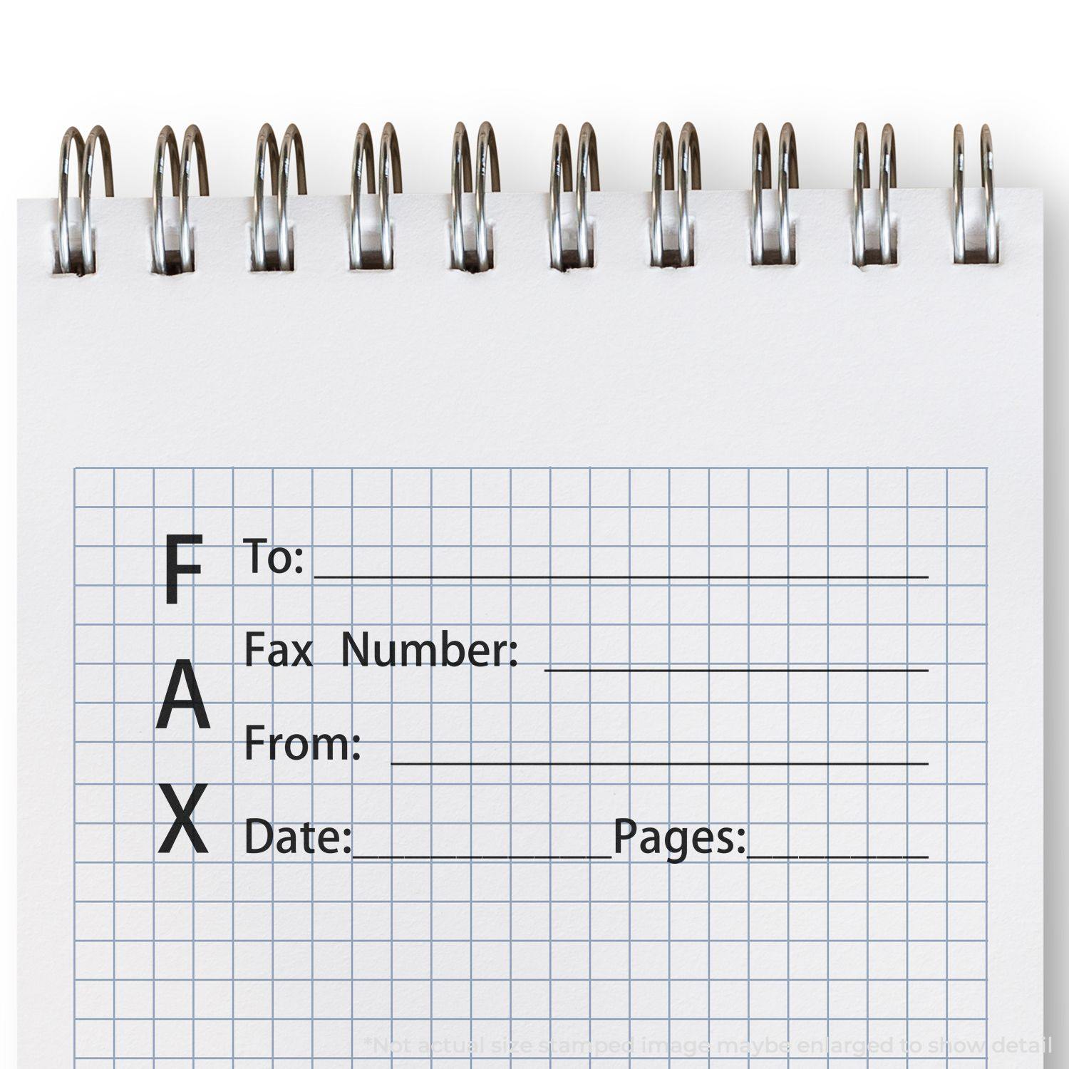 A notebook with a grid pattern and a FAX form stamped using the Fax It 1 Rubber Stamp, showing fields for To, Fax Number, From, Date, and Pages.