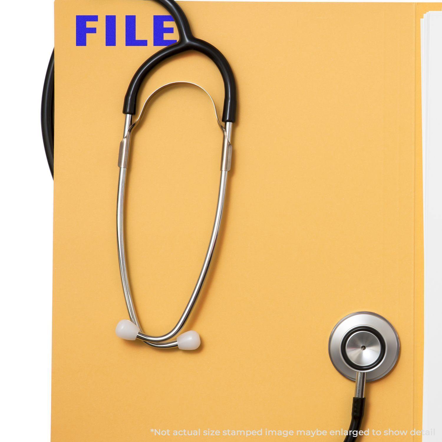 Yellow folder with FILE stamped in blue using a Slim Pre-Inked File Stamp, accompanied by a stethoscope on top.