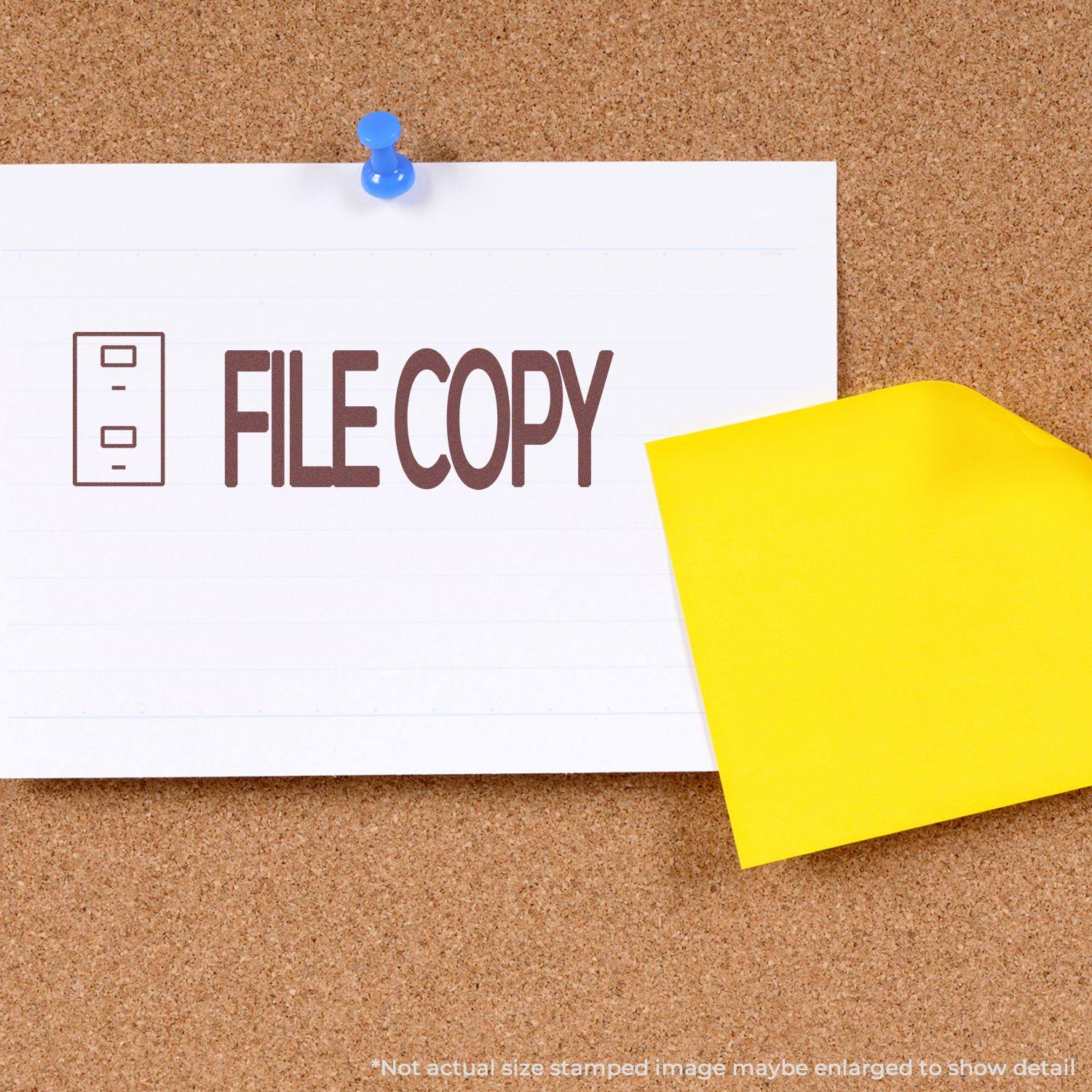 Self Inking File Copy with Drawer Stamp marking a paper pinned to a corkboard, with a yellow sticky note partially covering the paper.