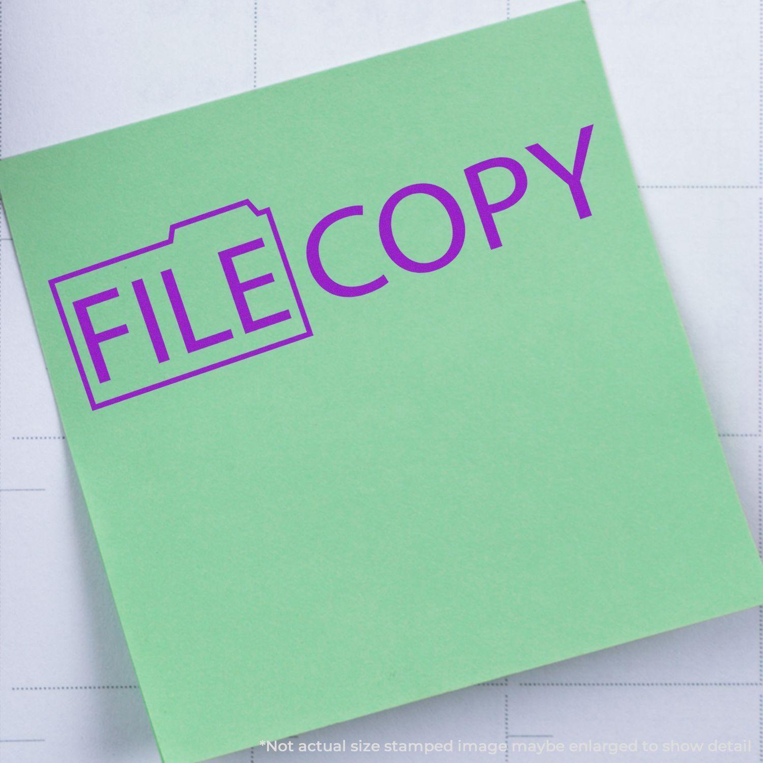 Green paper stamped with FILE COPY in purple using a Slim Pre-Inked File Copy with Folder Stamp.