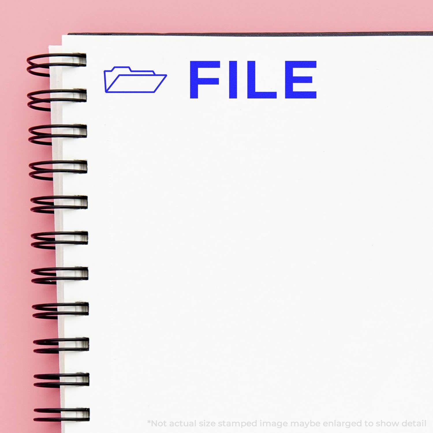 A self-inking stamp with a stamped image showing how the text "FILE" in a large bold font and a small icon of a file folder on the left side is displayed after stamping.