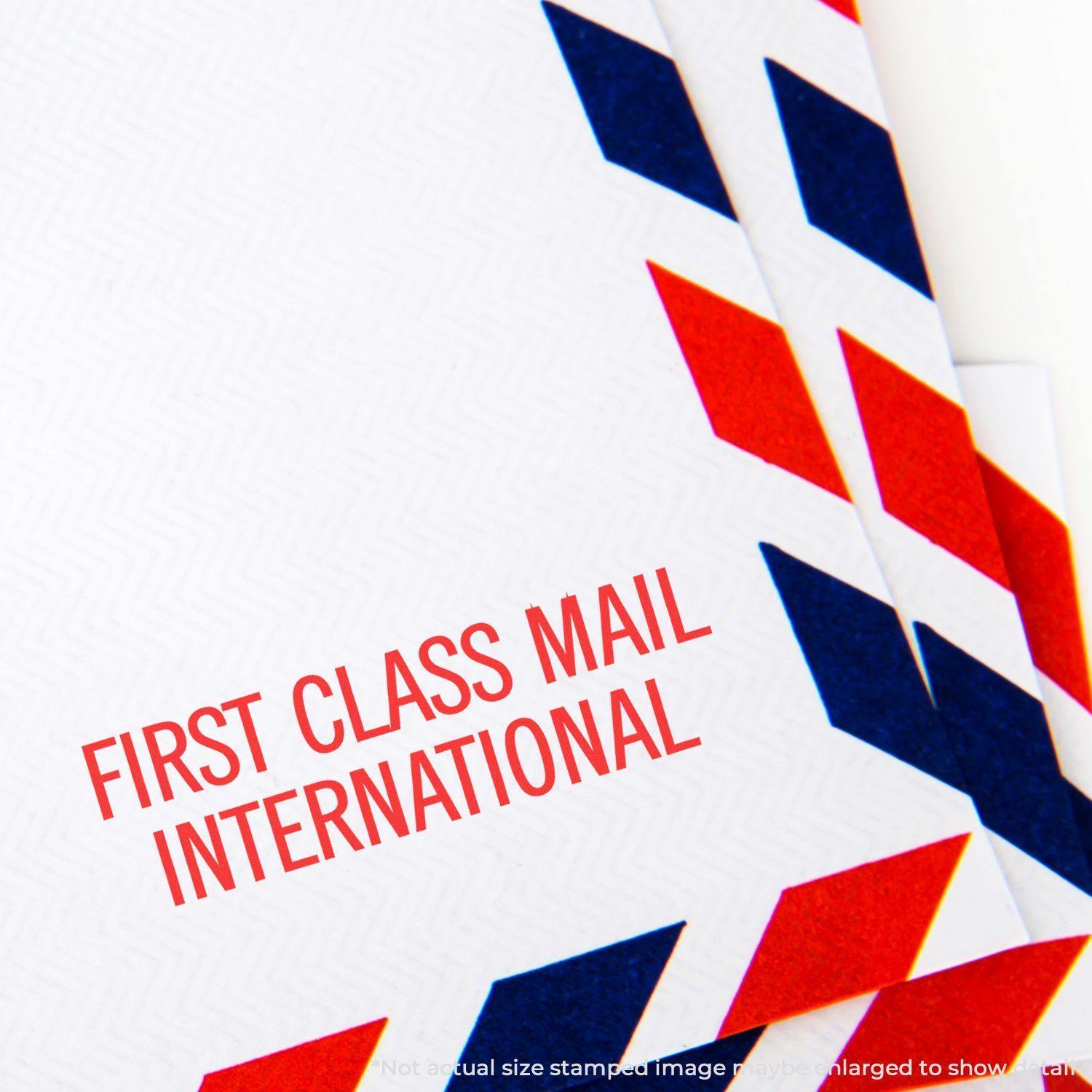 First Class Mail International Rubber Stamp used on white envelopes with red and blue chevron borders, emphasizing international mailing.