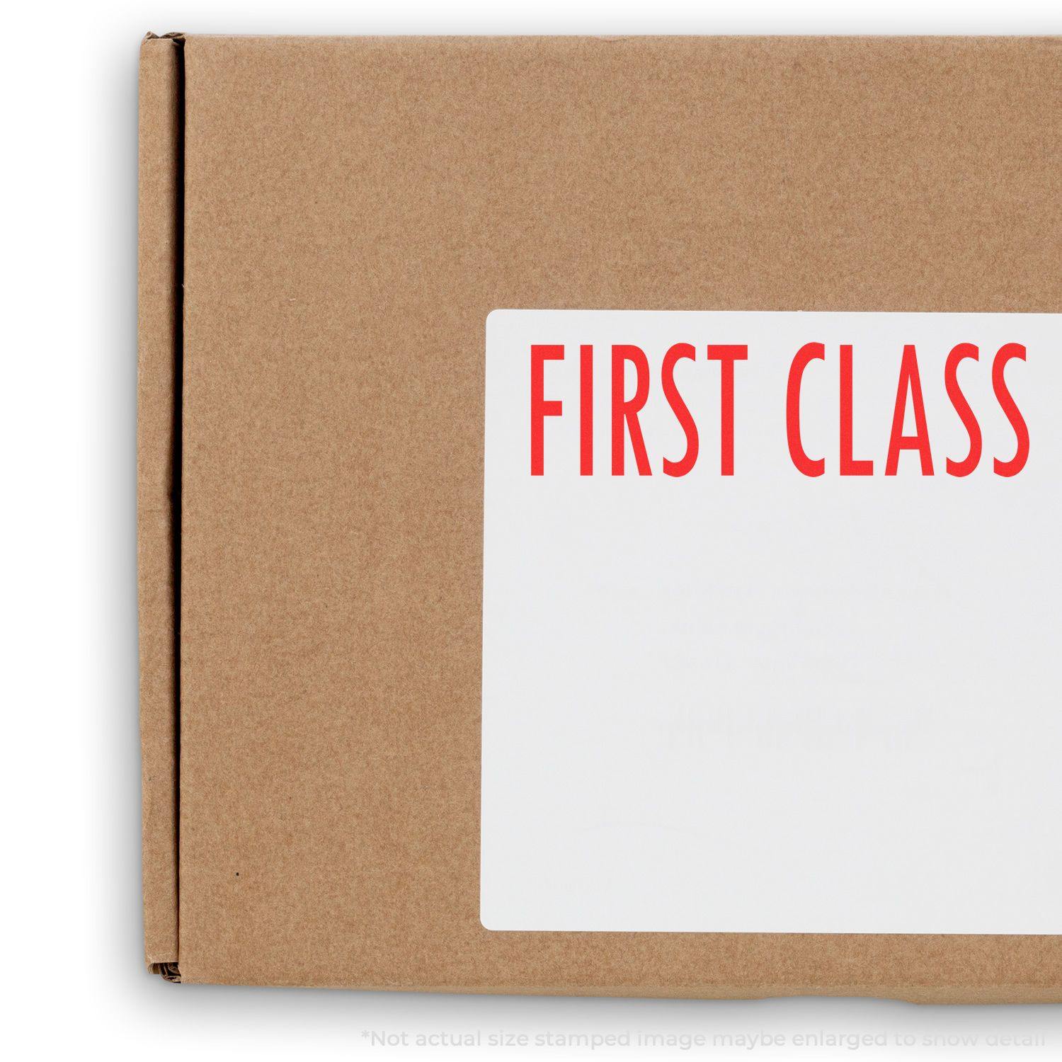 A self-inking stamp with a stamped image showing how the text "FIRST CLASS" is displayed after stamping.