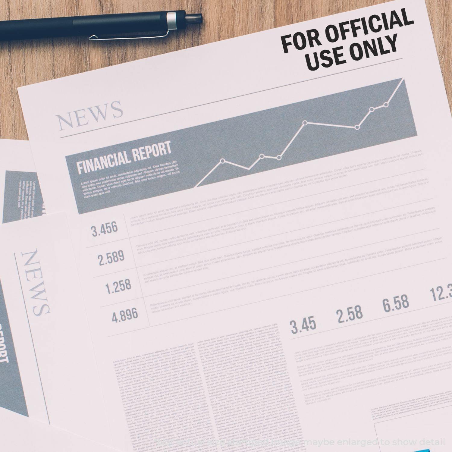 Large Self Inking For Official Use Only Stamp marking a financial report on a desk with a pen and other documents.